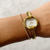 Vintage Gold Gucci Watch with Round Face