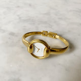 Vintage Gold Gucci Watch with Round Face